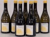 six bottles of wine sitting next to each other on a table