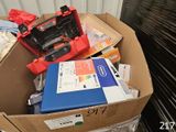 a cardboard box full of assorted items in it