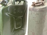 two jerry cans sitting next to each other on a table