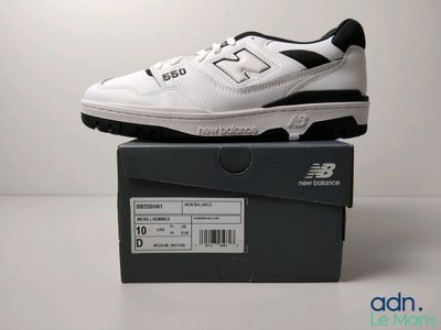 the new balance 995 is a white and black shoe with black accents