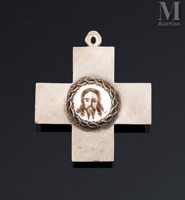 a cross with a picture of jesus on it on a black background