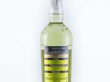 a bottle of alcohol sitting on top of a white surface