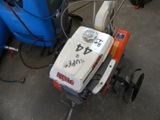a small machine that is sitting on the ground