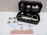 a black case with a brush, comb, and other items in it