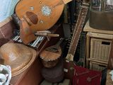 a guitar and other musical instruments in a room