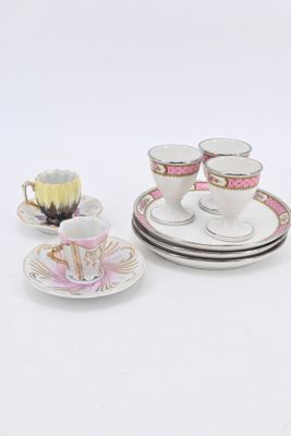 three cups and saucers sitting on a white table