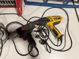 a picture of a corded corded drill and a corded hammer on a counter