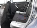 the back seats of a car with a seat belt in the back of it