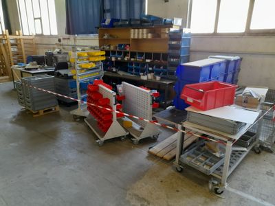 a large room with a lot of boxes and crates on the floor