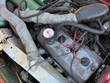 a red car that has a bunch of wires in it