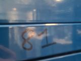 a close up of a blue bus with a number on it