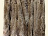 an image of a fur coat hanging on a hanger