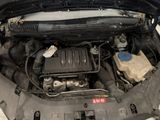 the engine of a car with its hood open and the hood down
