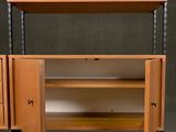 an image of a wooden entertainment center with shelves