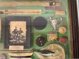 a picture of a display case with various items on it