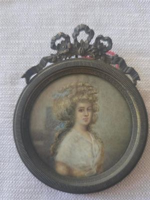 a picture of a woman in a white dress in a picture frame