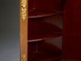 a cabinet that has a clock on top of it