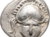 a silver coin with a woman ' s face on it