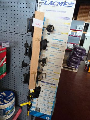 a picture of a rack of skis and snowboards in a store