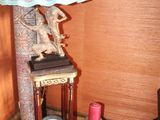 a lamp that is sitting on a table in a room