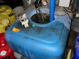 a blue water tank with a blue pipe sticking out of it