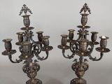 pair of antique brass candelabs with figurines on stands