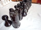 a lot of vases that are sitting on a table