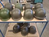 many helmets sitting on a shelf in a warehouse
