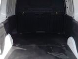 the back of a white van with the door open and the cargo compartment in the back of the van