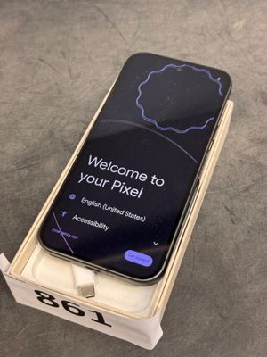 an iphone is sitting on top of a box with a welcome sign on it