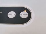 a close up of a button on the back of a cell phone