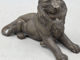 bronze statue of a lion with a crown on it ' s head