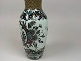 a vase that is sitting on a white surface