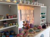 many bowls and bowls on the counter in this kitchen