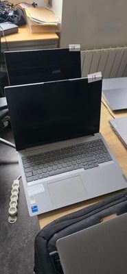 two laptops that are sitting on a table
