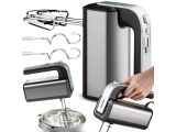 a silver and black electric hand mixer and other kitchen items