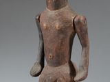 an image of a statue of a man standing on a black base