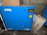a blue machine that is sitting in a room