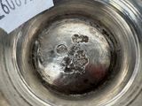 a silver bowl with a label on it
