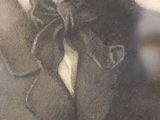 portrait of a man in a suit with a bow tie