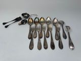 a group of silver spoons and spoon spoons sitting on a table