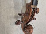 a violin that is hanging on the wall next to a wall