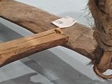 a piece of wood that has been tied up to a piece of wood