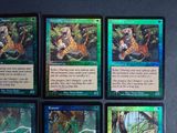 several cards of different animals in a forest with a black background