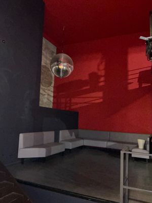 an image of a living room with red walls
