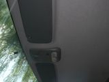 a view of the inside of a car with the sun shining through the window