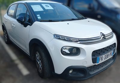a picture of a white car parked in a parking lot