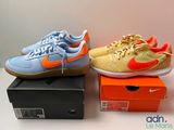 two pairs of shoes are sitting on top of a box