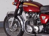 a red motorcycle that is parked in a garage