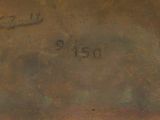 an image of a close up of a metal object with writing on it